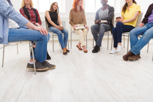 people participate in group therapy at one of the best gay drug rehab centers
